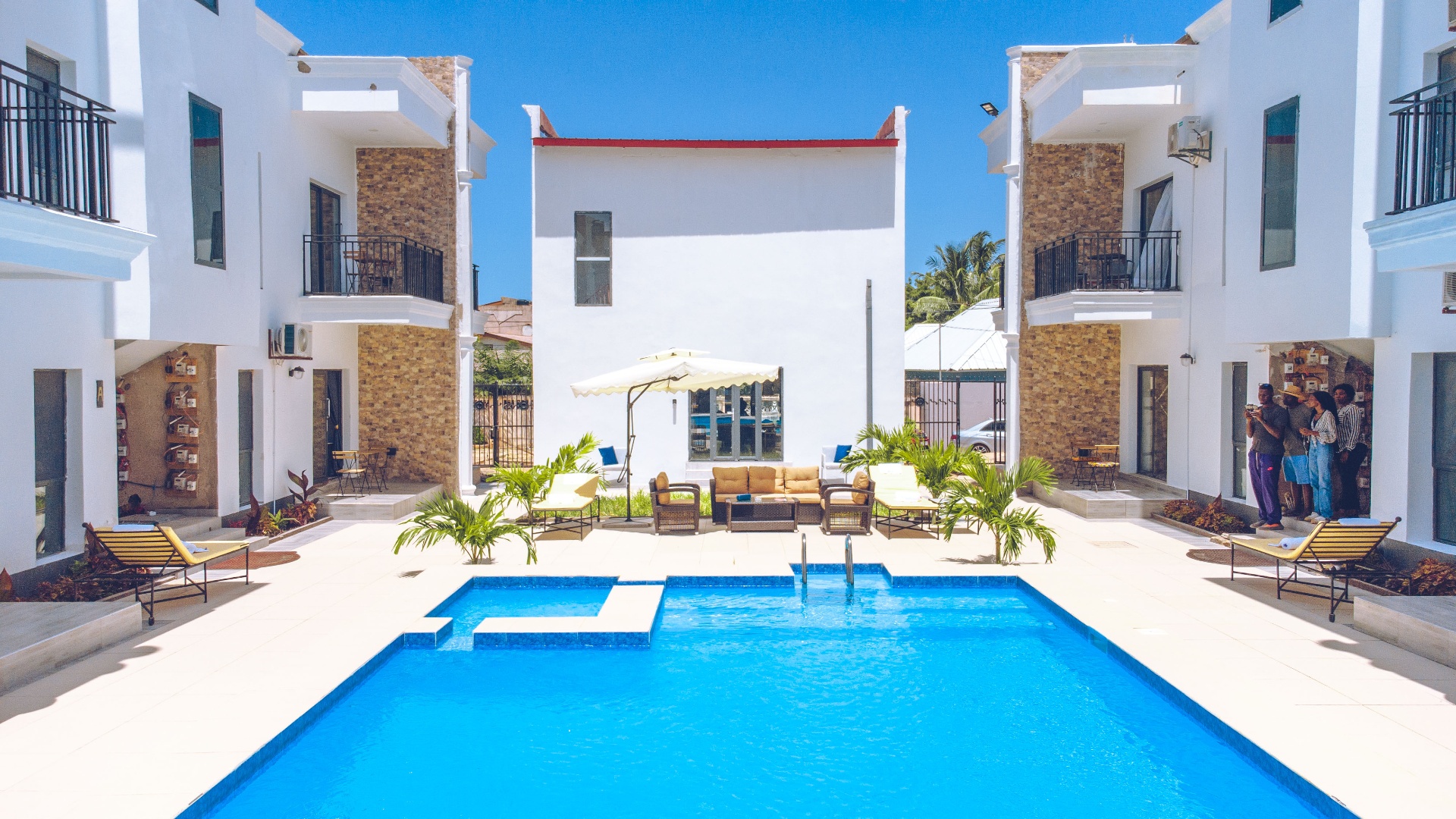 MICA Apartments pool with apartment facades on both sides