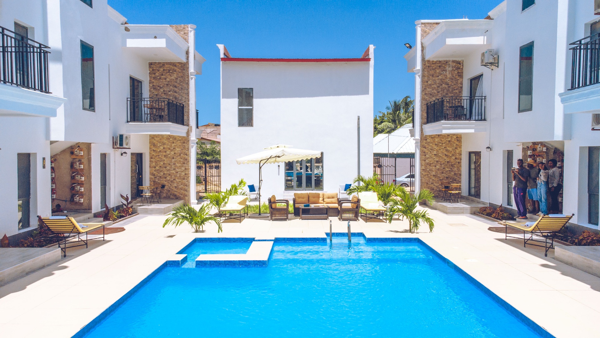 MICA Apartments symmetrical courtyard pool view