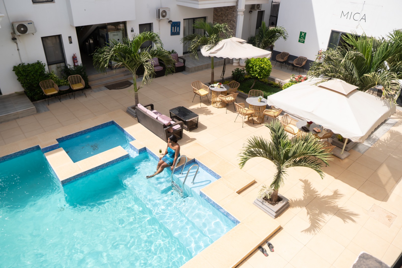 MICA Apartments aerial view with parasols and pool